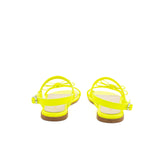 Sandalo in nappa giallo fluo con fiocchetto ton sur ton sul fronte. Chiusura con cinturino regolabile.